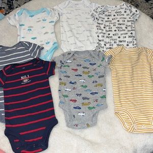 7 onesies in new condition